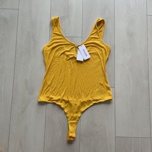 Brand New Guess Body suit Yellow/Mustard